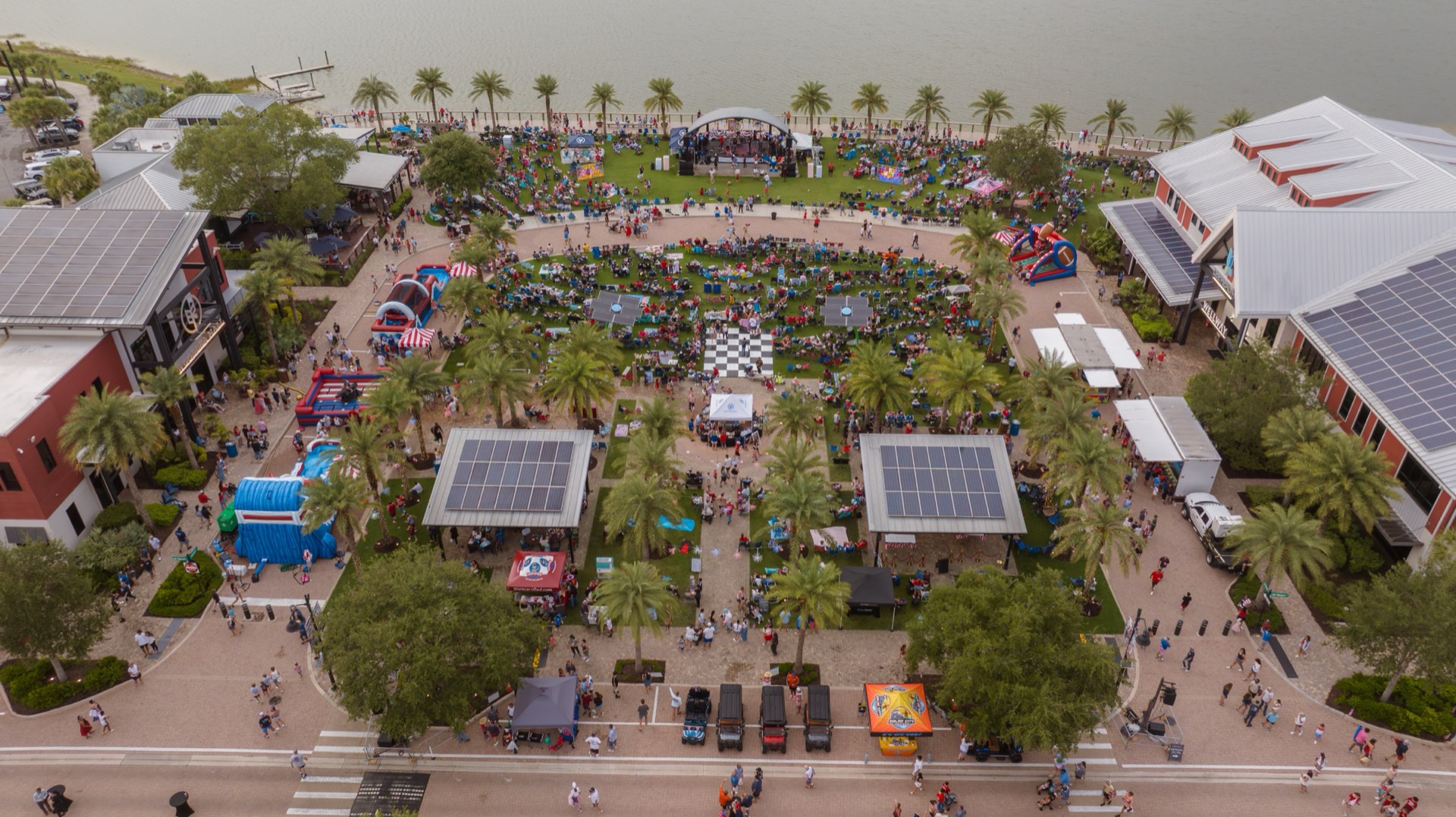 Aerial view of Founders Square, the lakeside stage and patriotic activities at Babcock Ranch’s 2026 Fourth of July celebration